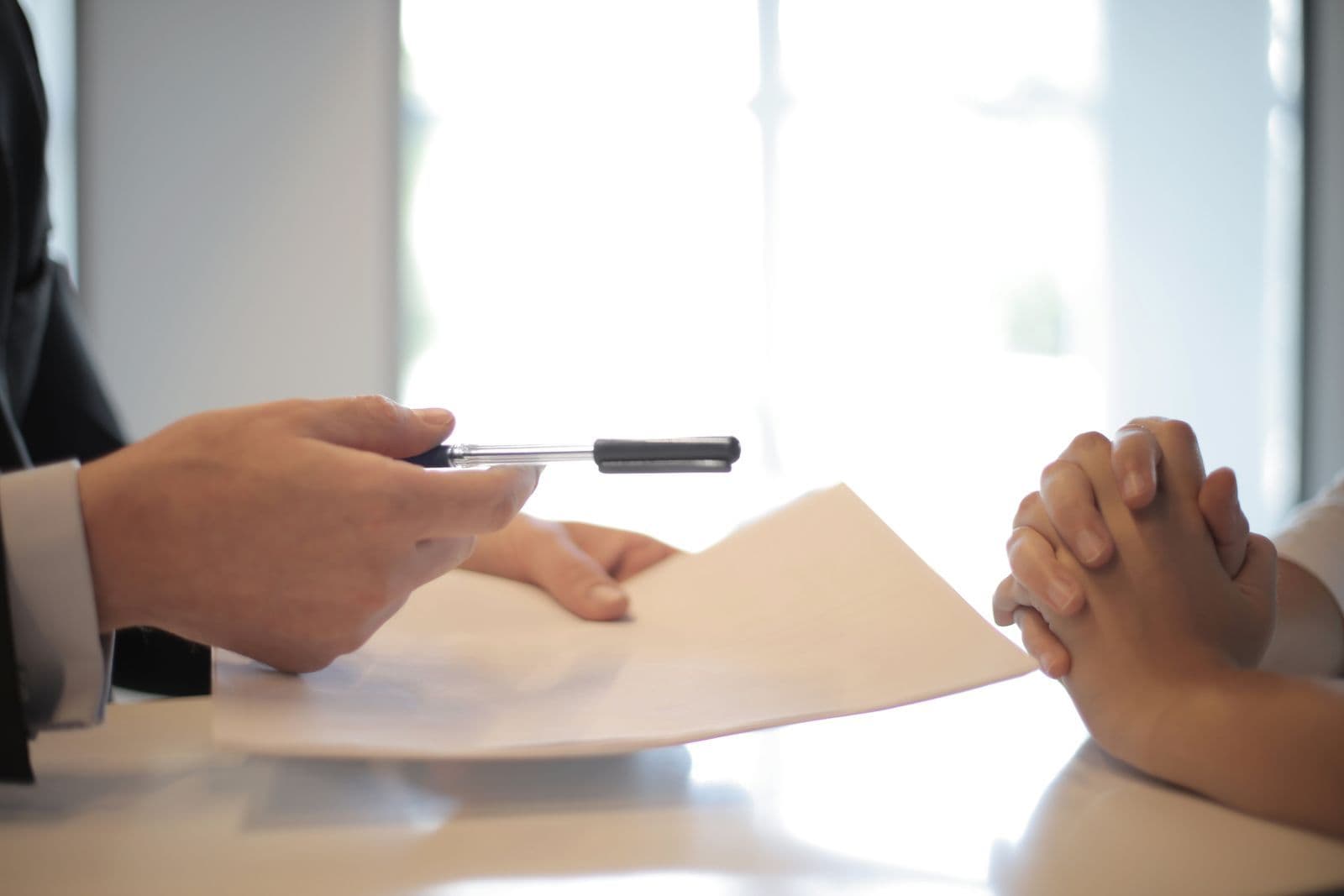 An adviser guiding the parties through a document at the table
